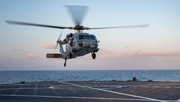 helicopter landing on aircraft carrier